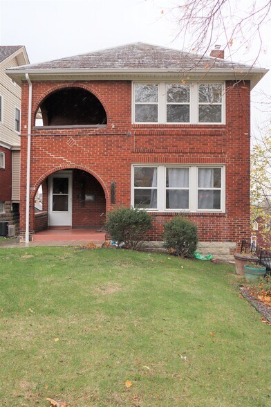 Enjoy the spacious front yard and inviting curb appeal in this well-maintained property. - 203 Richbarn