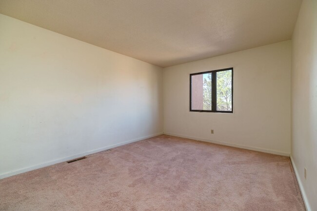 Building Photo - Two Story Condo Just off Old Taos Highway ...