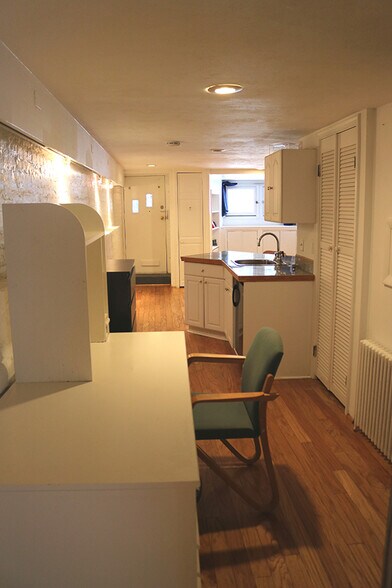 Study area foreground, kitchenette on right, entry on left - 3118 1/2 Dumbarton St NW