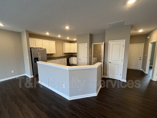 Building Photo - 5642 Brownstone Dr