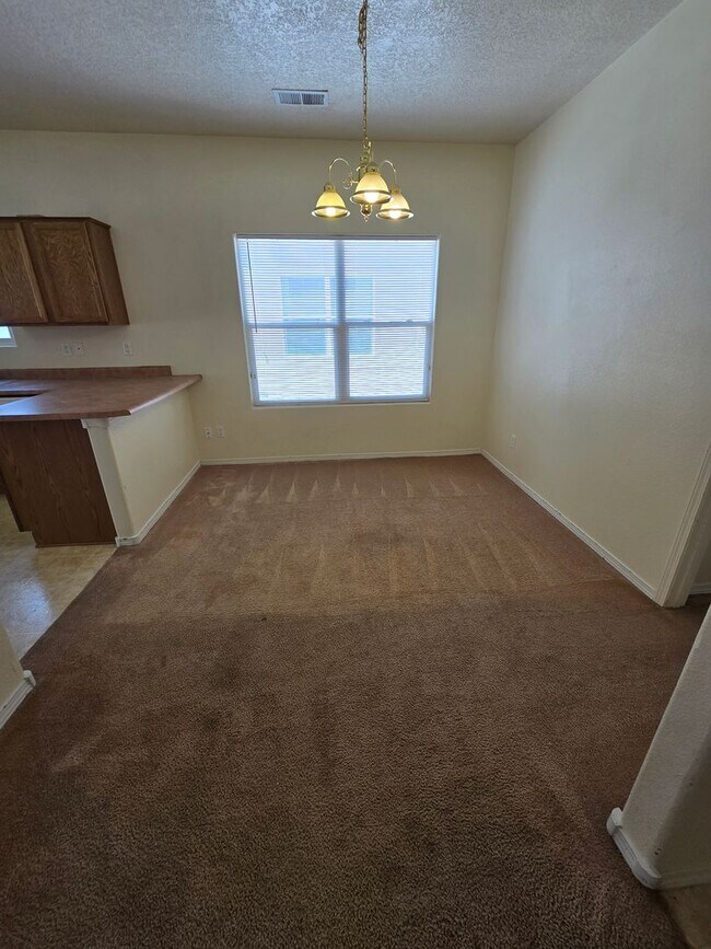 Building Photo - 4 bedroom 2 bath home with Refrigerated Air.
