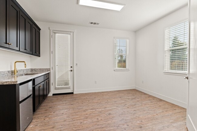 Building Photo - Sun-Filled Corner 4BR w/ Dual Yards & Panoramic Indoor-Outdoor Flow