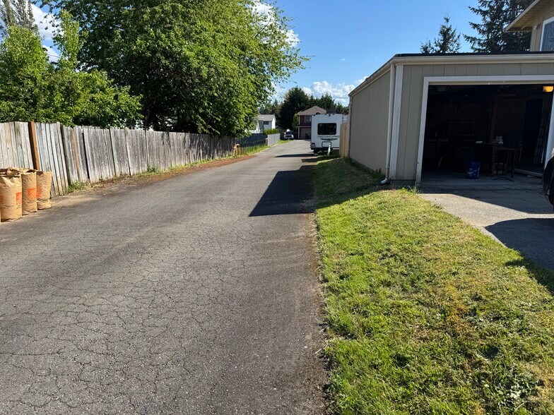 Alley next to driveway. This is access to houses behind and parking is not allowed in the alley - 13016 16th St NE