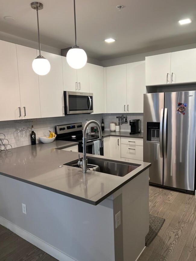 Kitchen with stainless steel appliances and quartz countertops - 1898 S Bannock St