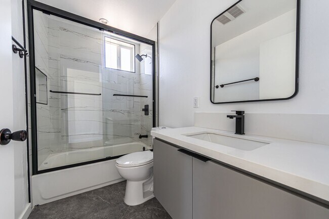 Building Photo - Contemporary 4-Bed, 4.5-Bath Townhome with...