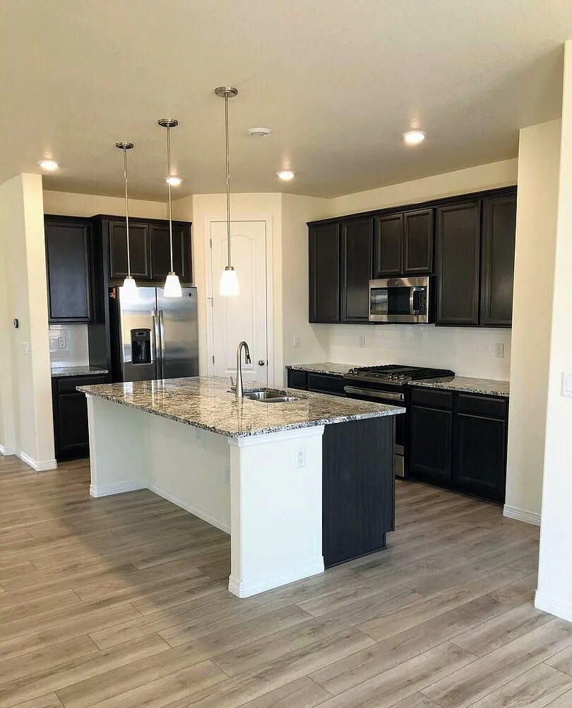 Kitchen with SS appliances and gas range - 16384 Fillmore St