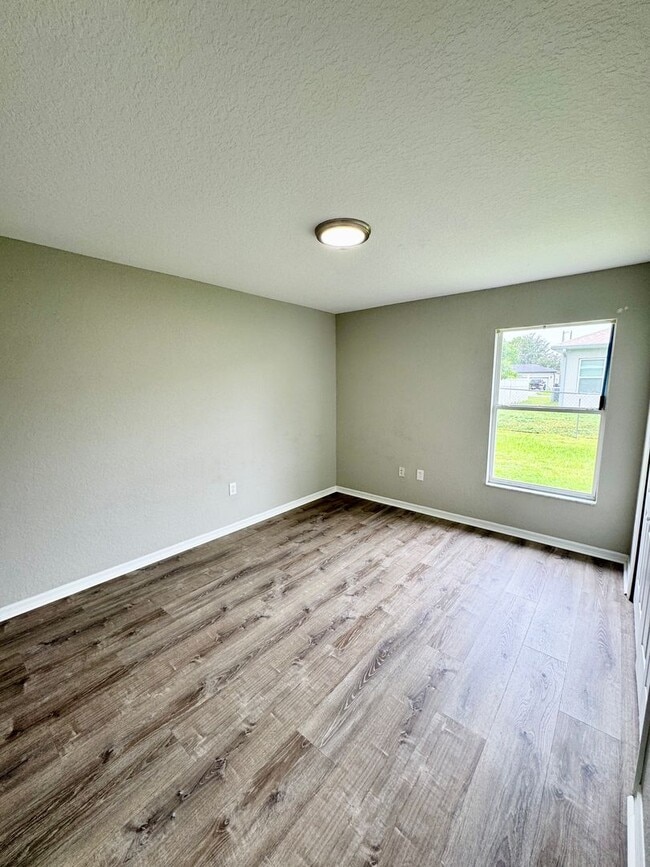 Building Photo - 4 Bedroom 2 Bath Home in Poinciana Village 3