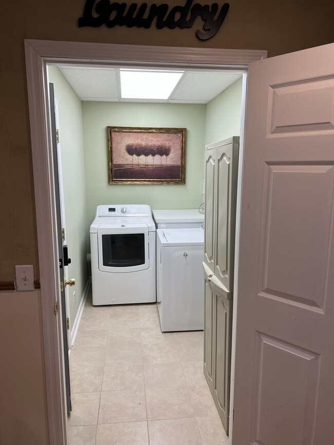 Laundry room with storage. - 3617 Sunset Rdg