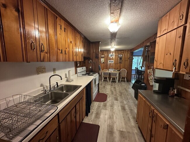 Building Photo - Charming 3BR Waterfront Retreat with Sunroom, Brick Accent & Scenic Lake Views