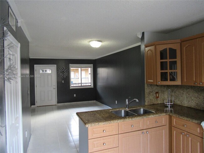 Building Photo - 5490 W 21st Ct