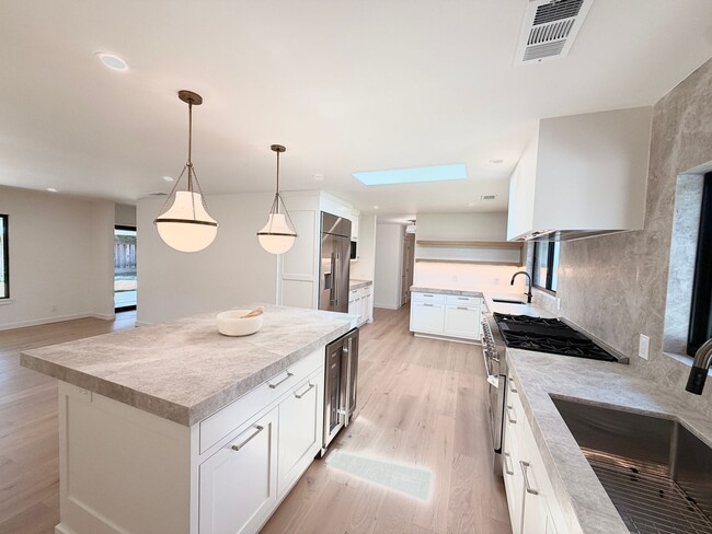 Building Photo - This premier 4-bed, 3-bath estate spans 2,565 sq. ft. on a 10,253 sq. ft. lot in North Los Altos.