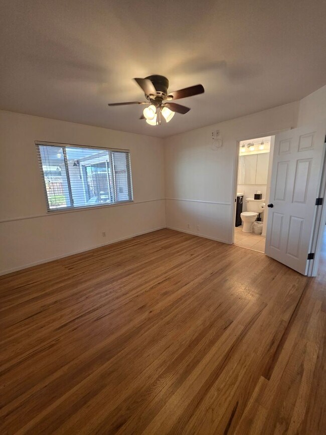 Building Photo - Delightful Single Story 2/2 with Expanded Bath and Beautiful Gardens