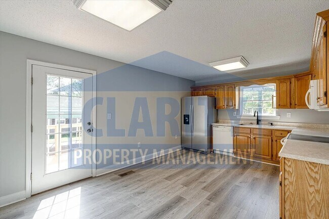 Building Photo - Updated house with carport and shed on corner lot!