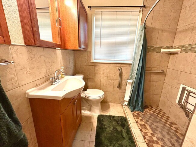 Building Photo - *MOVE IN SPECIAL* Stylishly Renovated Home with Fenced Backyard & Two Living Areas!