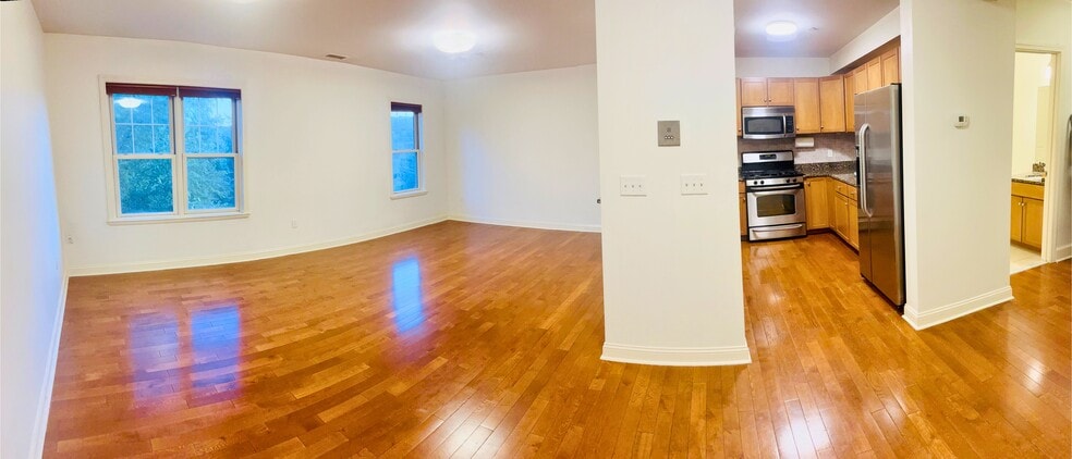 Living Room, Kitchen and Half Bath on the first level - 391 Pleasant St