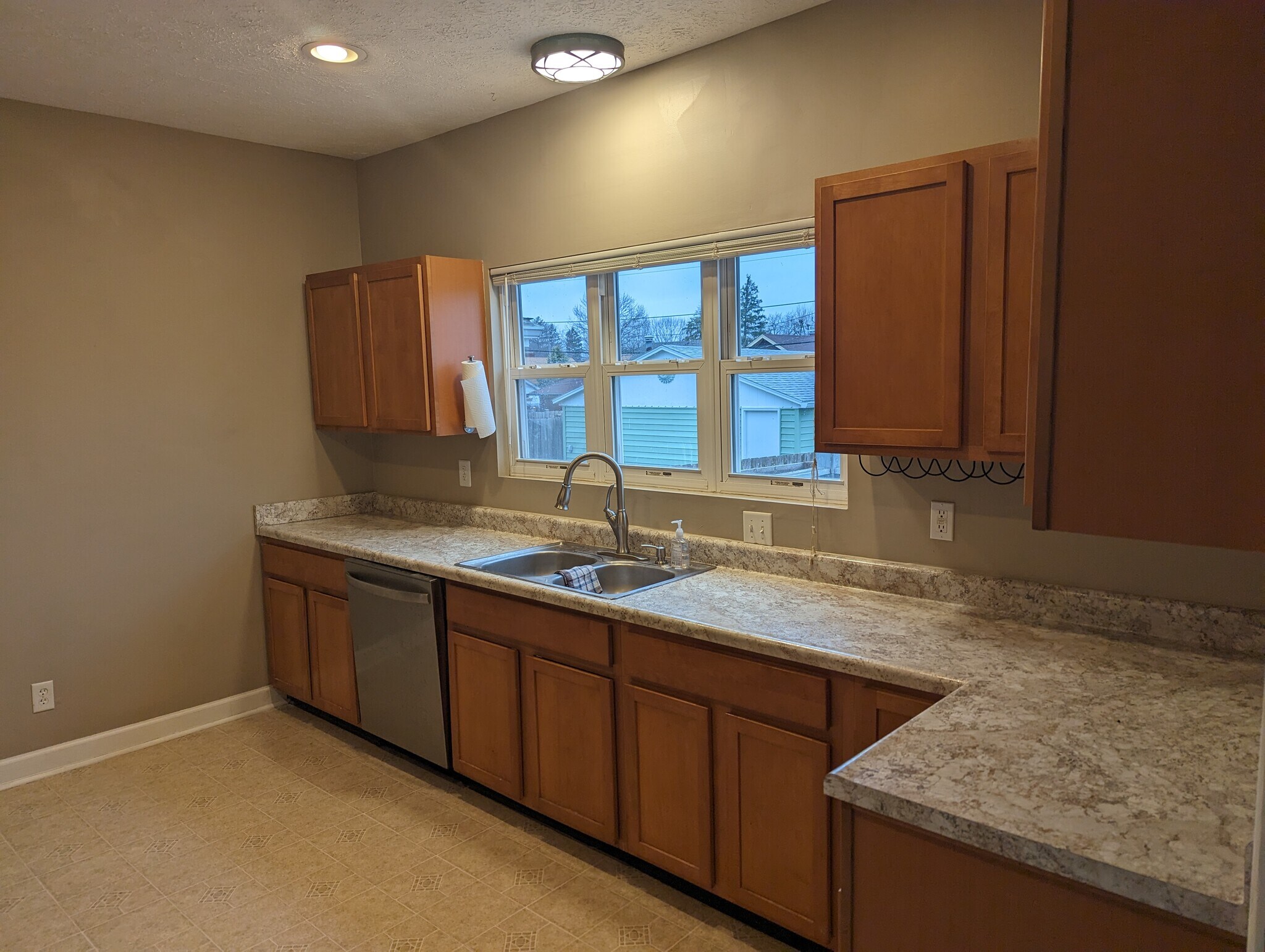 Kitchen with new countertops, lots of natural lighting. - 1042 Cameron St