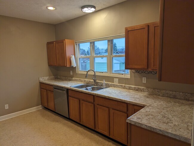 Kitchen with new countertops, lots of natural lighting. - 1042 Cameron St