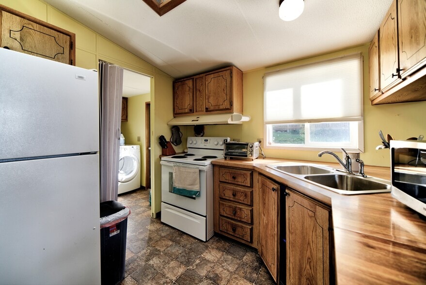 Kitchen has microwave, stove and toaster oven. - 5170 W Shore Rd