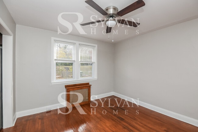 Building Photo - Welcome to this charming abode.
