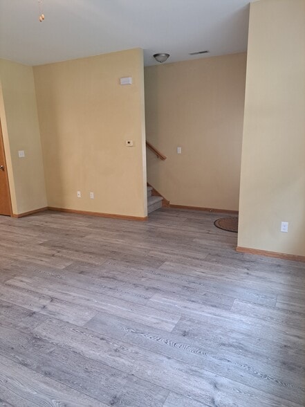 Living area, entry and stairs to 2nd floor - 603 3rd Ave