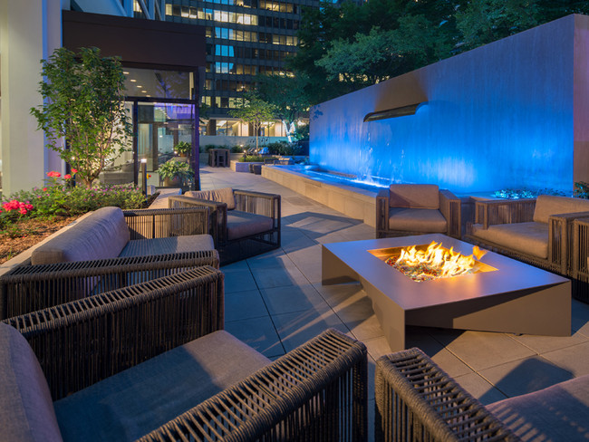 Enjoy the ambiance of our cozy fire pits and relaxing waterfall - Columbus Plaza