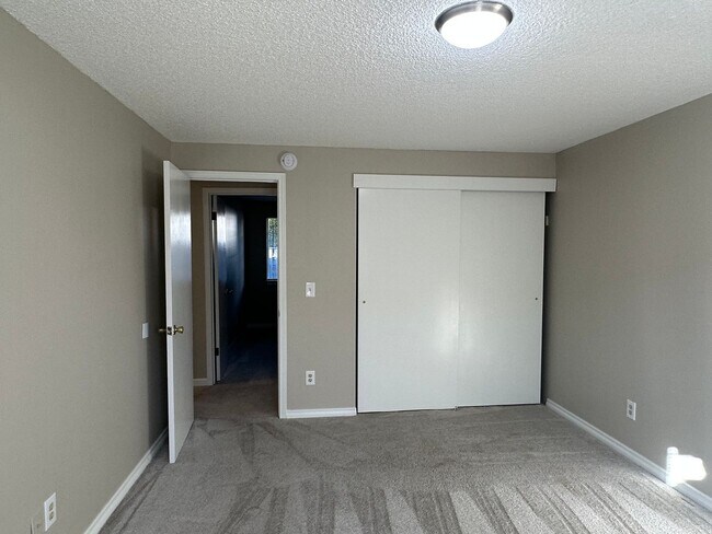 Building Photo - Spacious & Stylish 3BD Home with Iconic Stone Fireplace + Soaking Tub