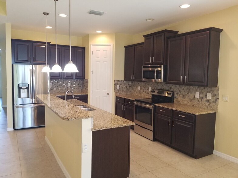 Building Photo - Celebration Cape - Gated Community - 3/2+Den/2 car garage