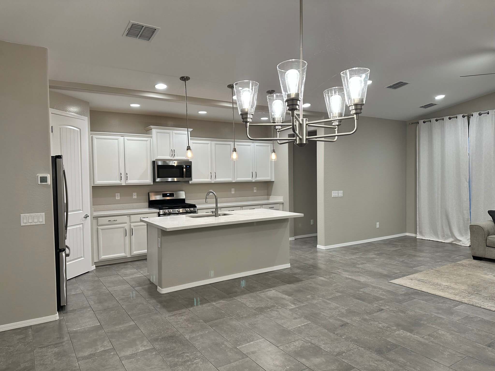 Attached covered backyard patio adjacent to kitchen & family room. - 6272 Barn Owl Ave