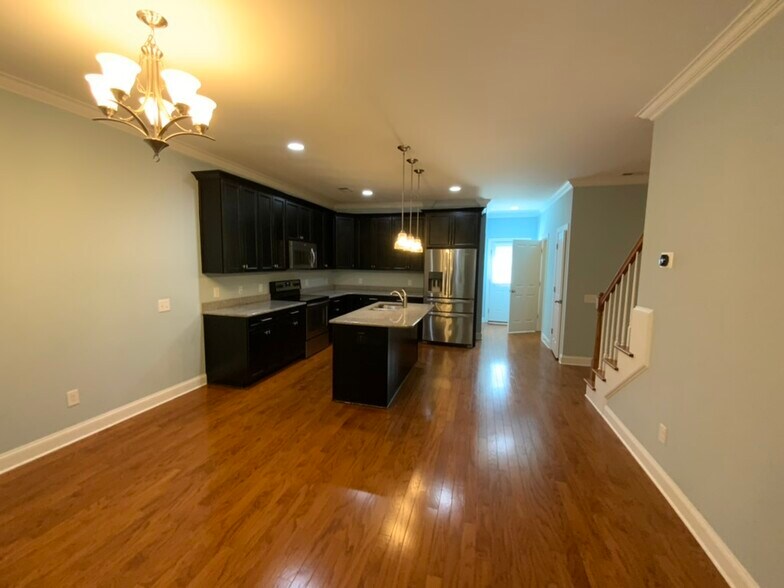 Kitchen adjacent to living room - 10220 vanguard pkwy