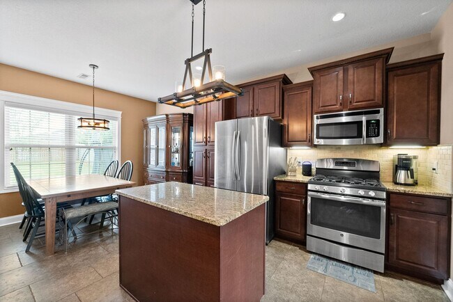 Building Photo - Spacious 4-Bedroom Home with Dual Living A...