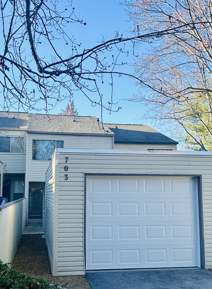 Front of unit and garage . Garage door and roof replaced 2023 - 703 Idlewood Ln