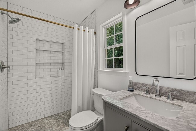 Building Photo - Charming Cow Horn Village Home with Outdoor Shower & Fenced Backyard