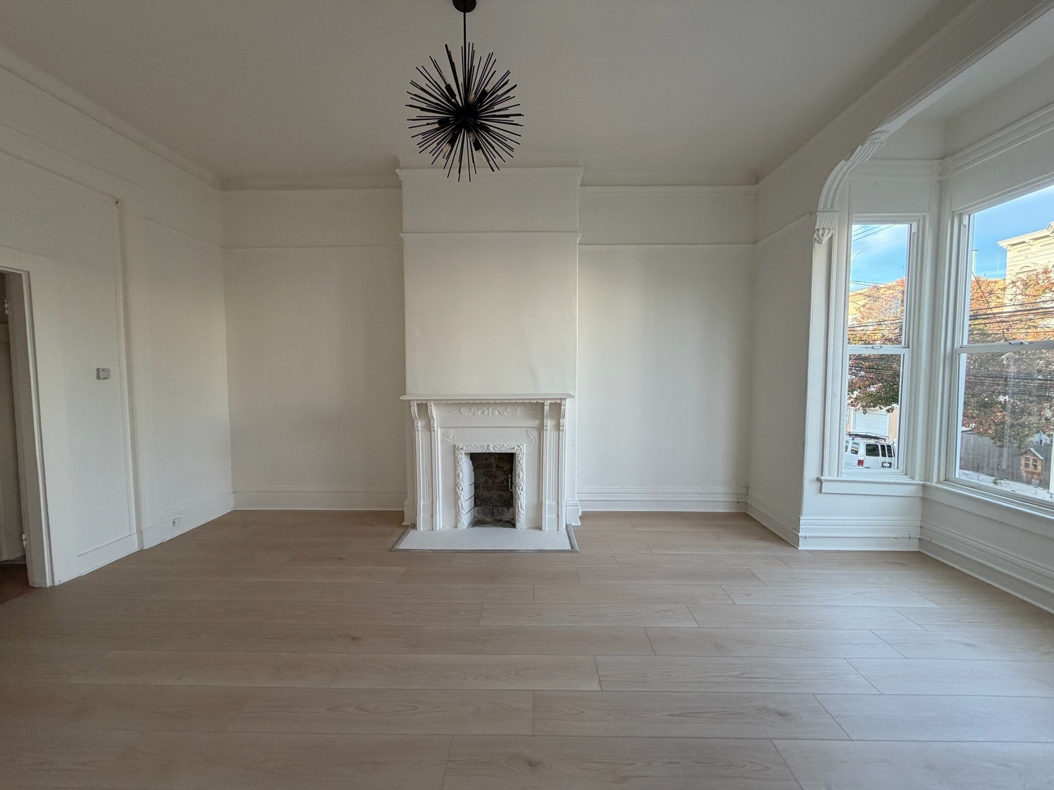 Expansive living room with high ceilings and new luxury vinyl floors - 1330 Alabama St