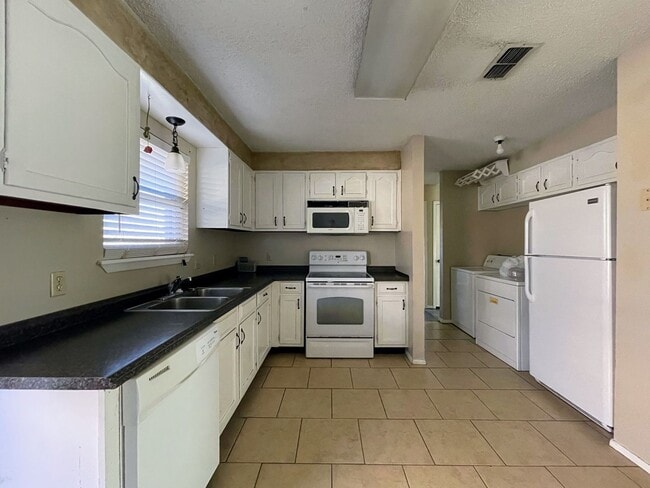 Building Photo - Your Dream Duplex Awaits in Charming Snyder!