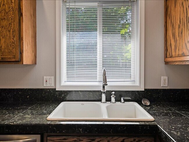 Building Photo - June Rent Free!!  Move Today!  Four Bedroom, Three Bath Home with Beautiful Backyard, Two Car Gar...
