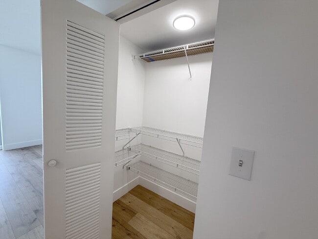 Building Photo - Rare 2/2 Corner Penthouse with Panoramic Lagoon Views from Every Room – Available Now!