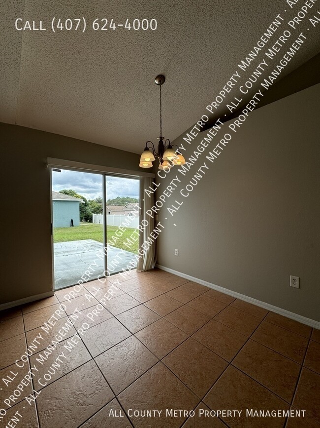 Building Photo - 3 Bedroom Poinciana Gem!