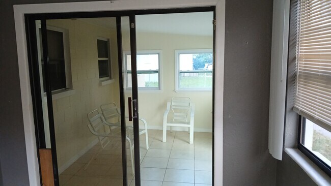 Dining room to Sunroom East view - 211 Sandy Cir