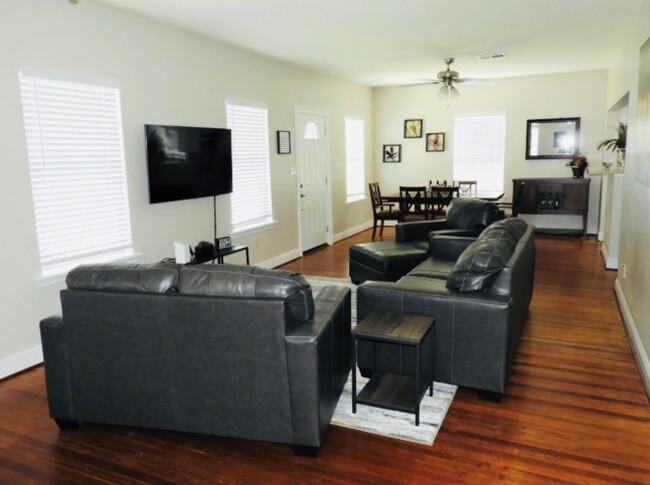 Wide angle of the furnished living room. - 405 Winnie St