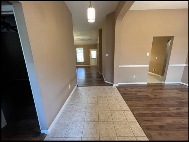 Looking in from door, 2 bedrooms and bathroom to left - 3511 Misty View Ln