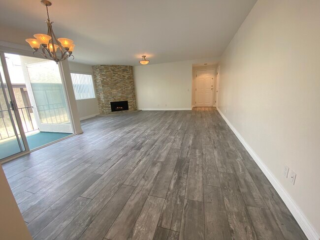 LARGE OPEN LIVING AREA W/ PLANK FLOORING - Large Remodeled 2x2 Unit with Huge Patio