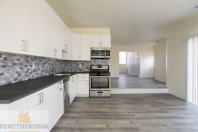 Building Photo - Updated 4BR House with 2 full baths and yard!
