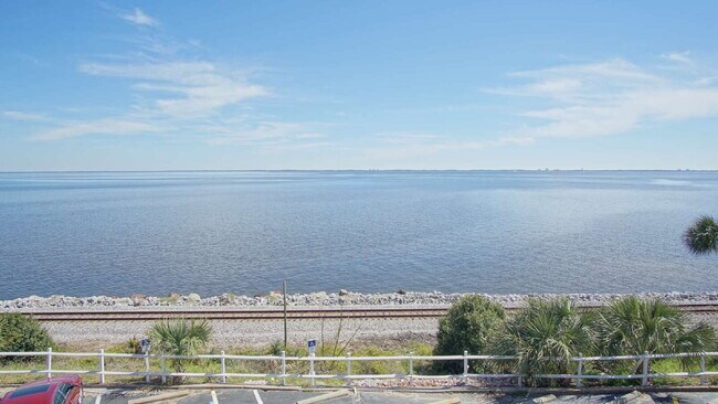 Building Photo - Coastal Condo Living with Pensacola Bay Views, Waterfront Pool Access & Prime Location Near Downt...