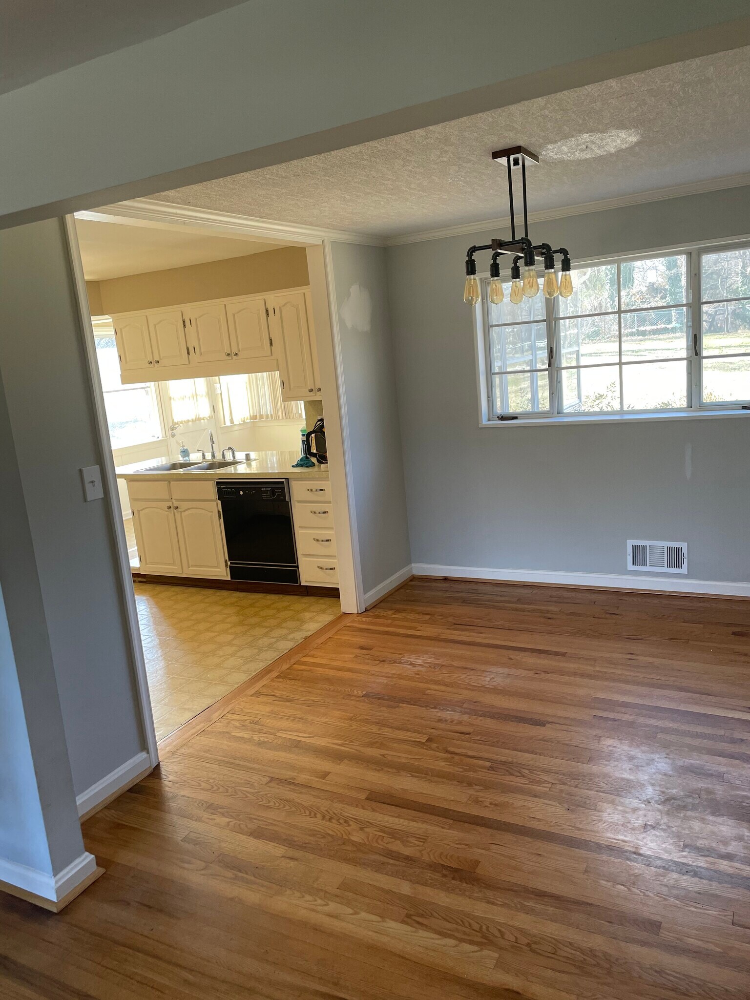 Open kitchen, living and dining area with lots of natural light - 3322 Wraywood Pl