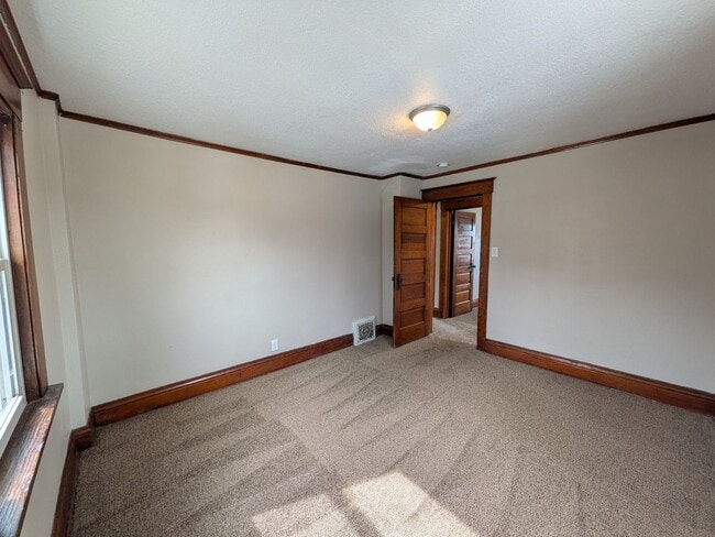 Building Photo - Large 4 Bedroom Home with Garage, Deck, & Fence!