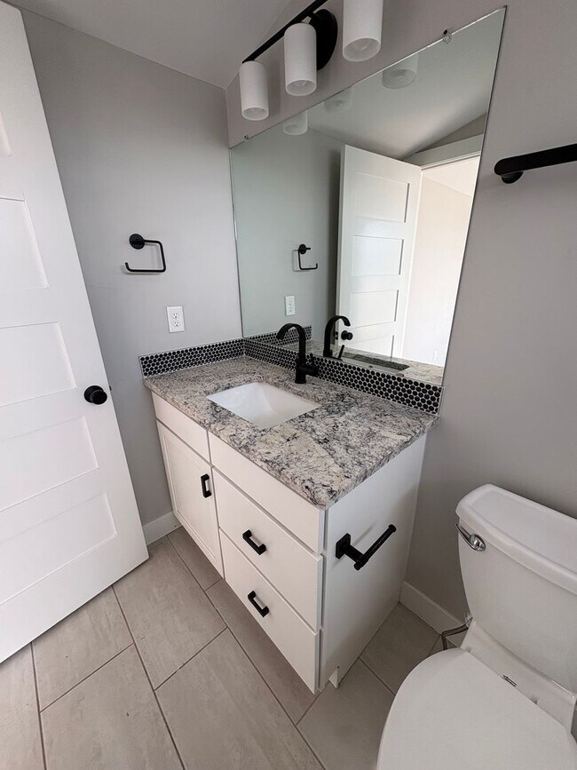 Building Photo - Modern 2 Bed + Flex Townhome with Rooftop Deck Near Paco Sanchez Park & Light Rail