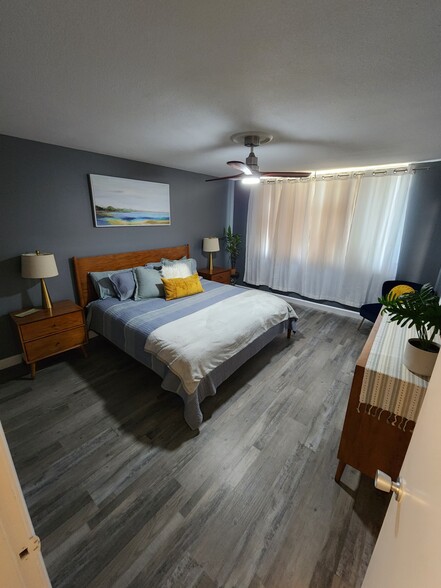 Primary Bedroom with blackout curtains drawn - 5180 N Wishon Ave