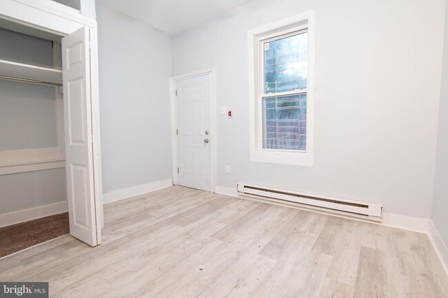 Building Photo - 7022 Woodland Ave