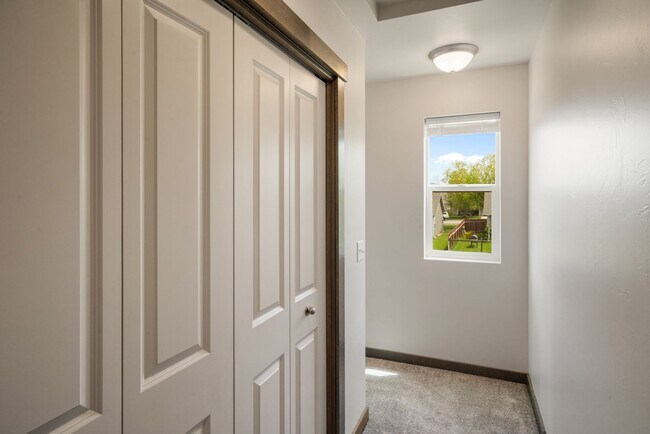 Building Photo - Pet Friendly! Gorgeous 3 Bedroom condo with double stall attached garages with AC.