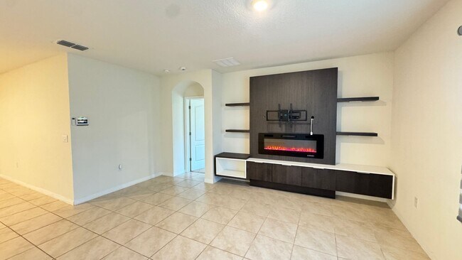 Building Photo - Available NOW! Spacious 4BD/2BA Haven in Villages at Harmony – Your Dream Home Awaits! WASHER & D...